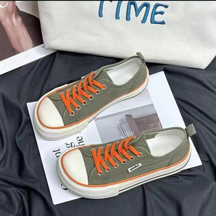 2026 primavera y verano nuevos zapatos de lona de mujer de altura baja con suela gruesa delantera correa de abertura superficial zapatos de lona casuales de estudiantes