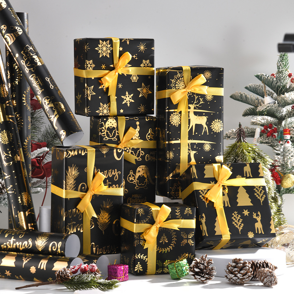 Nuevo papel de regalo de oro negro de Navidad transfronterizo papel de cobre brillante copo de nieve papel de regalo de ciervo de Navidad papel de regalo