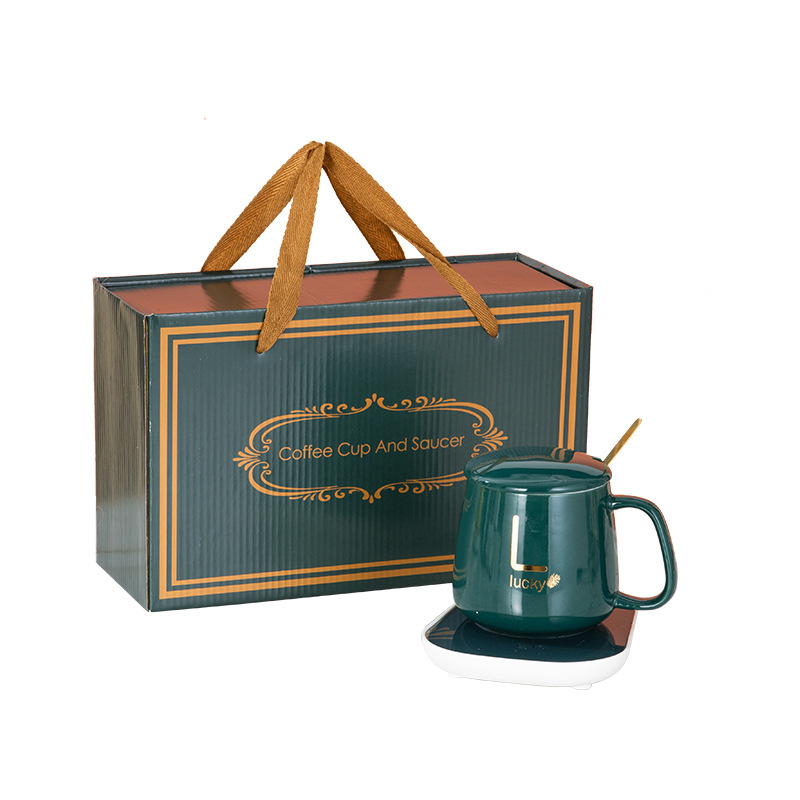 Taza caliente 55 grados taza de temperatura constante conjunto simple taza de calefacción taza de agua de cerámica regalo del hogar ventosa al por mayor