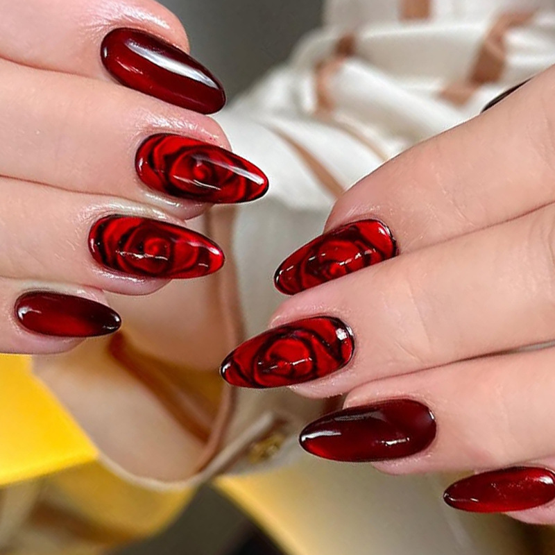 Wine-red rose gradient cat-eye nail art, long almond-shaped nails, cherry red and black rose pattern, artificial nails Wine-red rose gradient cat-eye nail art, long almond-shaped nails, cherry red and black rose pattern, artificial nails