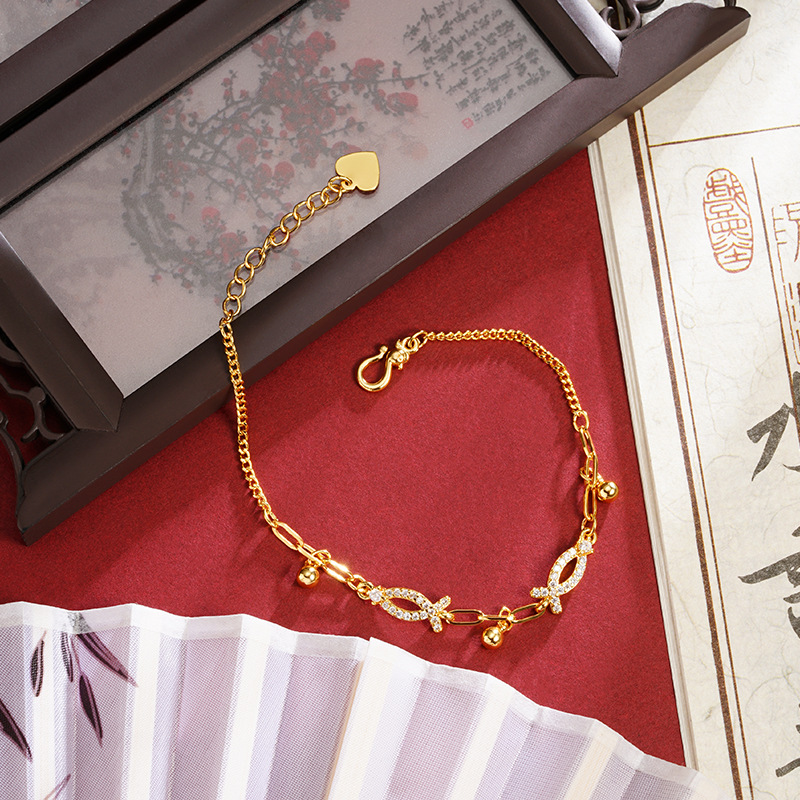 Nuevo producto pulsera de oro de lujo ligera línea de pulsera de oro de lujo pequeño pez bordilla esfera pulsera de moda femenina joyas de mano versátiles