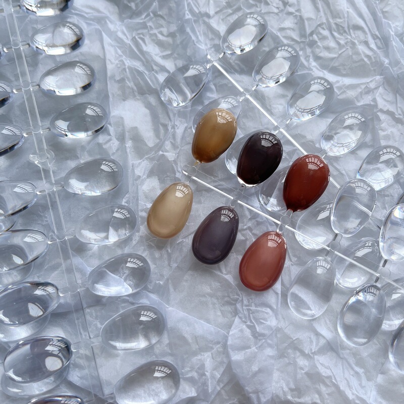 The whole row of painted nail art color card tool round egg-shaped solid plastic transparent practice color plate bean beads display board