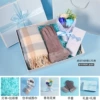 Scarf + gloves + bouquet + blue box