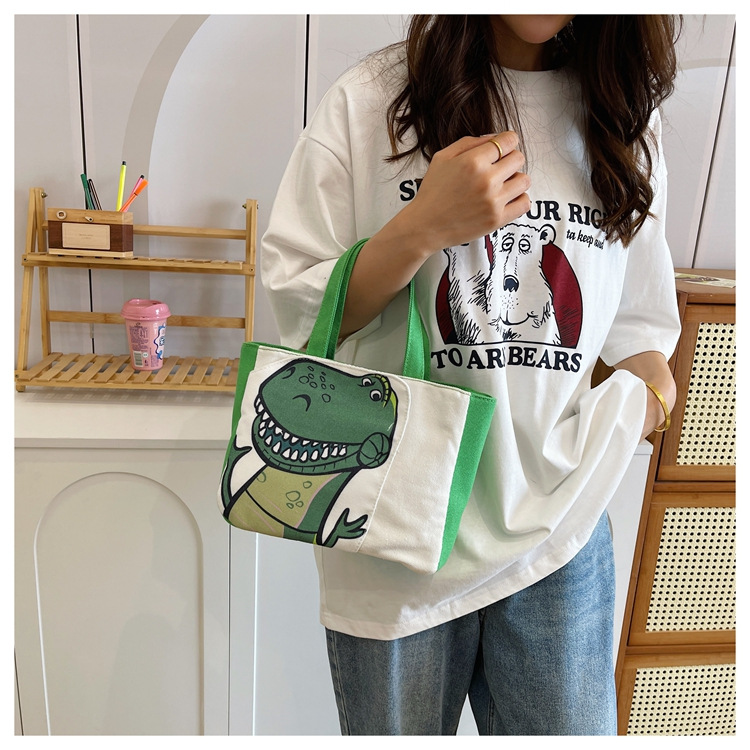 Cute cartoon printed small bag, 2024 summer new style hand-held piggy girl handbag, student storage canvas bag undefined