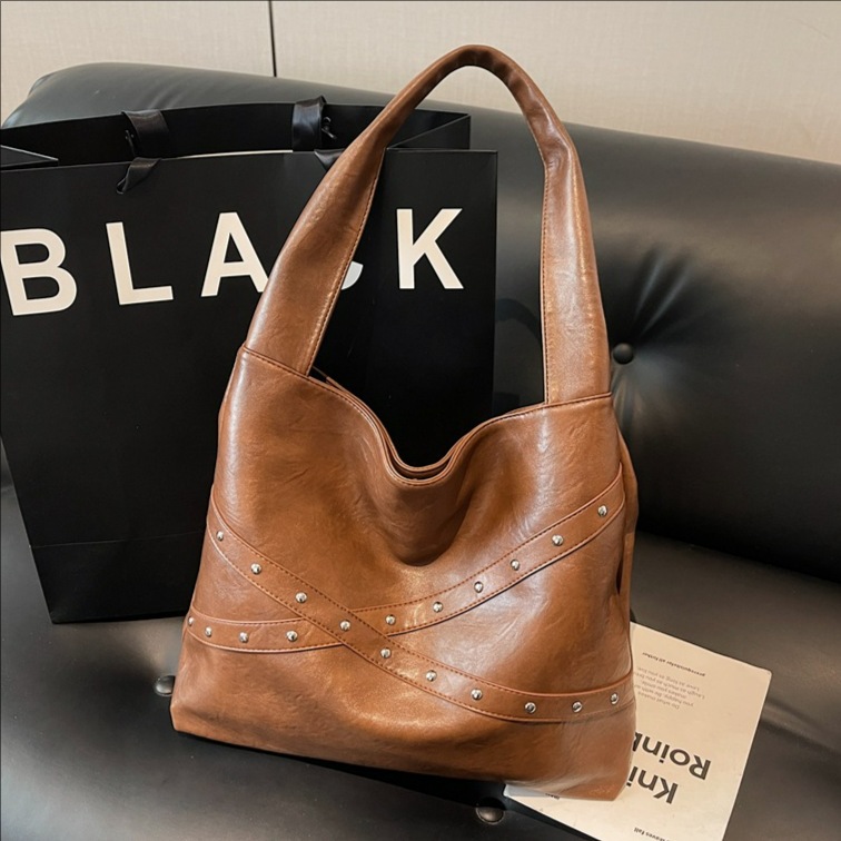 Transfronterizos retro nicho bolsas de cubo portátiles 2025 nuevo transporte de gran capacidad bolsa bolsa de hombro de locomotora