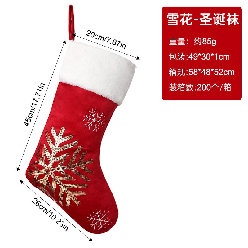 Gold flakes Christmas stocking snowflakes on red background
