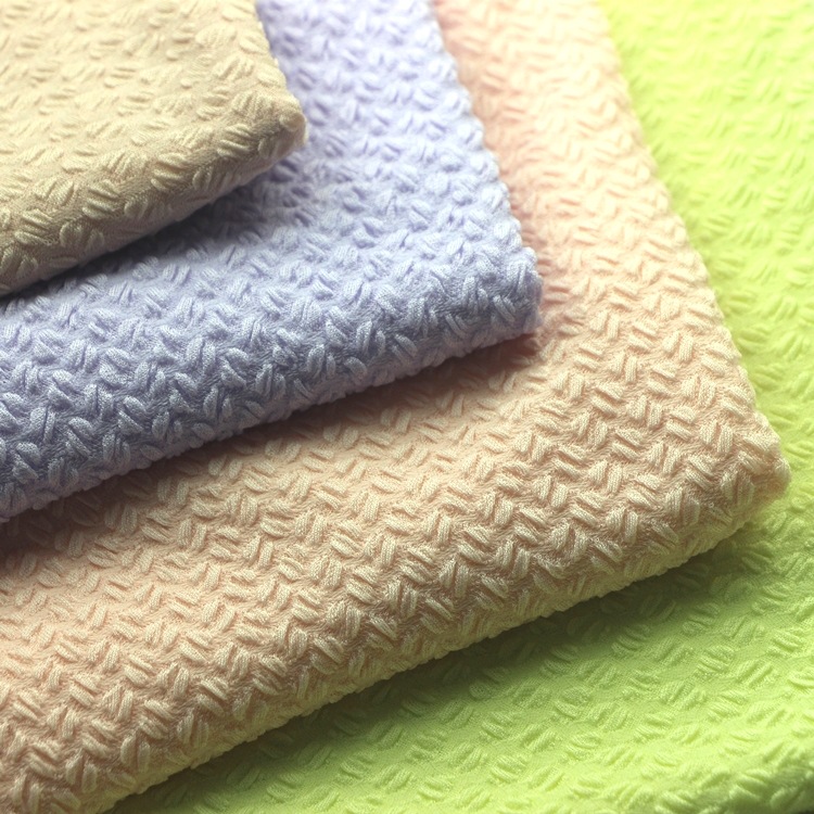 提花咖啡豆单面布汗布服装面料针织纬编全涤氨纶起皱泡泡单面布料