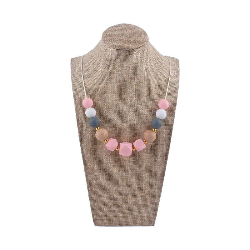 Los nuevos bebés de contraste de color de silicona octogonal mordedor collar de los bebés mordedor palo masticable colgante collar