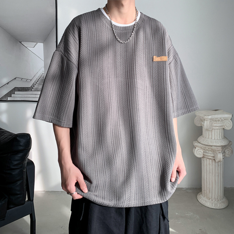 Camiseta de manga corta de verano de Hong Kong Tide para hombres inins coreanos sueltos versátiles Jacquard camiseta de cuello redondo de marca de marea chaqueta transpirable