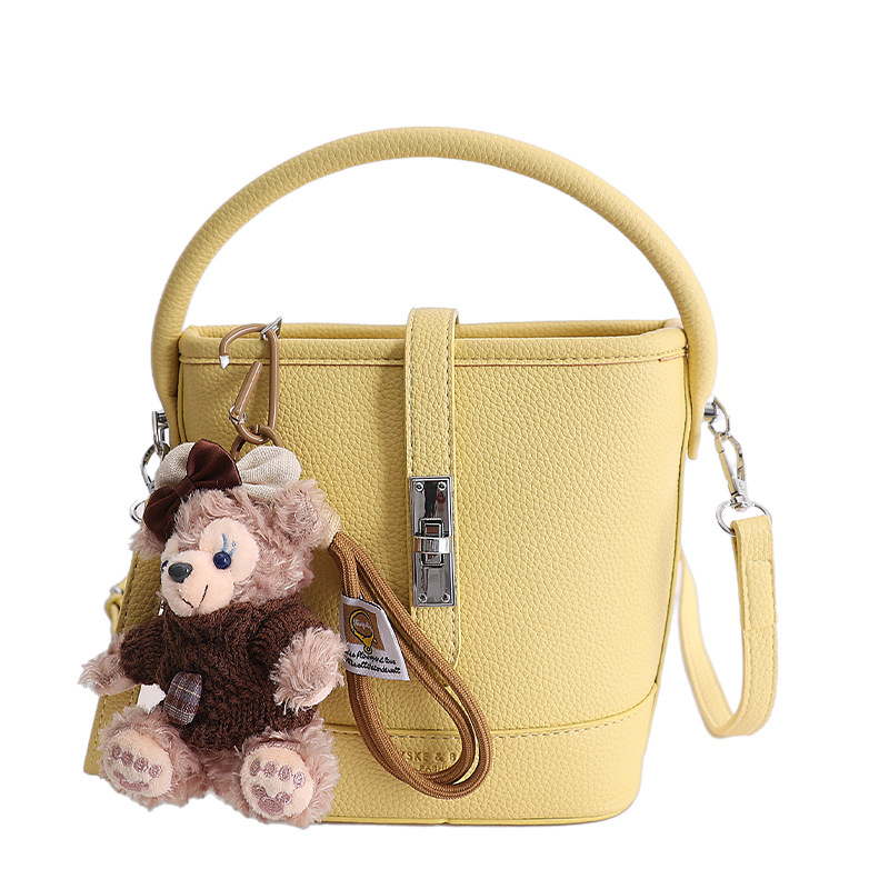 Litchi estampado bolso de cubo de mano mujer 2026 venta caliente nueva moda coreana alta textura mochila de hombro
