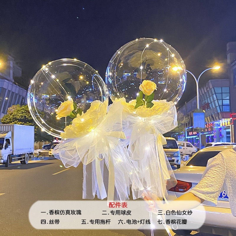 光る夜市の円形の赤い屋台のネットを並べてボールを押して会の風船のイルミネーションの明かりの告白のロマンチックな波の地帯のスーツを押します。|undefined