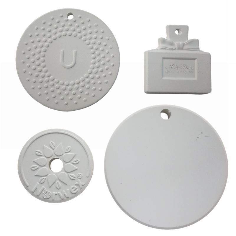 Perfume expandido personalizado Tabletas volátiles Tabletas de aromaterapia de cerámica Tabletas de aromaterapia a granel Colgante de aromaterapia de yeso Desodorización de coche de flores