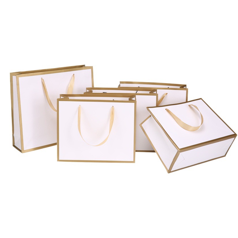 Bolsa de regalo cuidado de la piel tienda de ropa bolsa portátil bolsa de papel cartón blanco bolso cosmético logo bolsa de regalo creativo