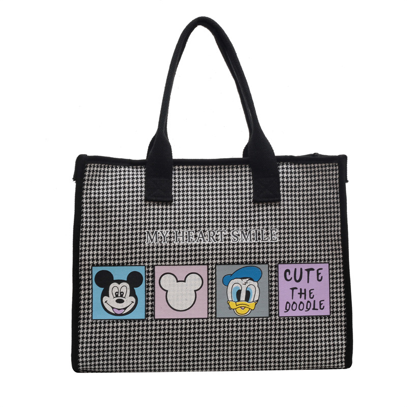 Bolso de mujer de alta sensación 2025 nuevo lienzo simple impresión de gran capacidad bolso de mano bolso de hombro de caricatura mamá