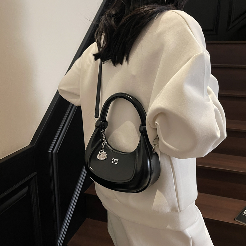 Bolsos de diseño de nicho de tendencia transfronteriza para mujer 2025 nuevo bolso de hombro retro salvaje bolso de axila de moda occidental