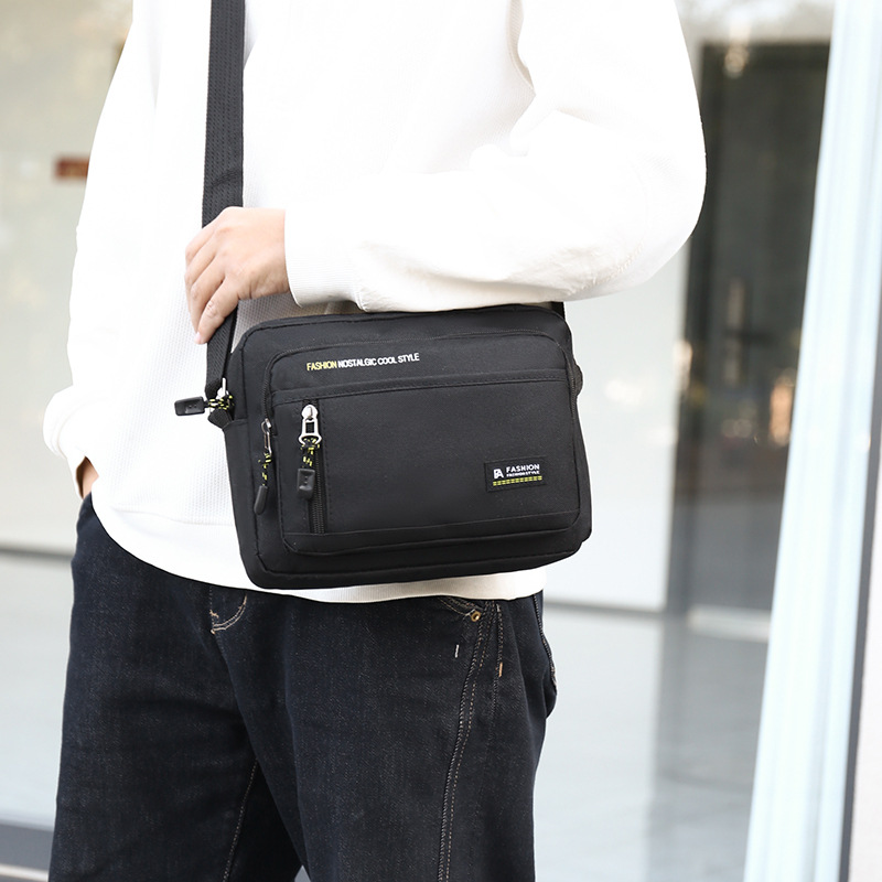 Bolso de hombro casual de gran capacidad para hombres, nuevo bolso de mensajero ligero y simple de comercio exterior, maletín portátil para viajes de negocios