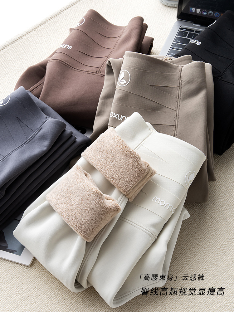 トンボのズボンの白い秋冬の無痕のバービーのズボンの女性の高腰はやせています。