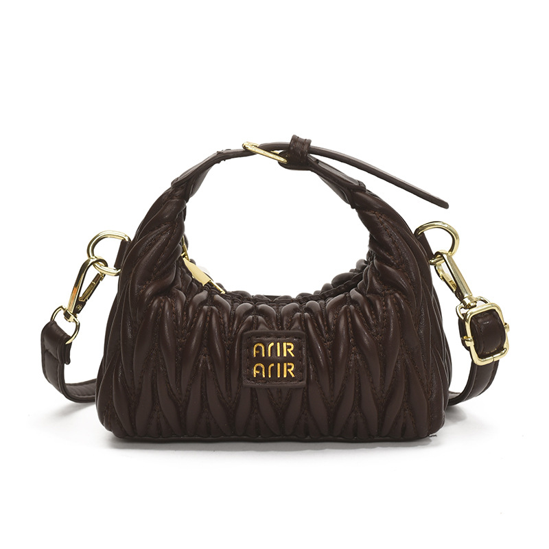 Bolsa de hombro de chicas plegadas de moda simple color sólido mini bolso de bebé 2025 nuevo bolso infantil transfronterizo