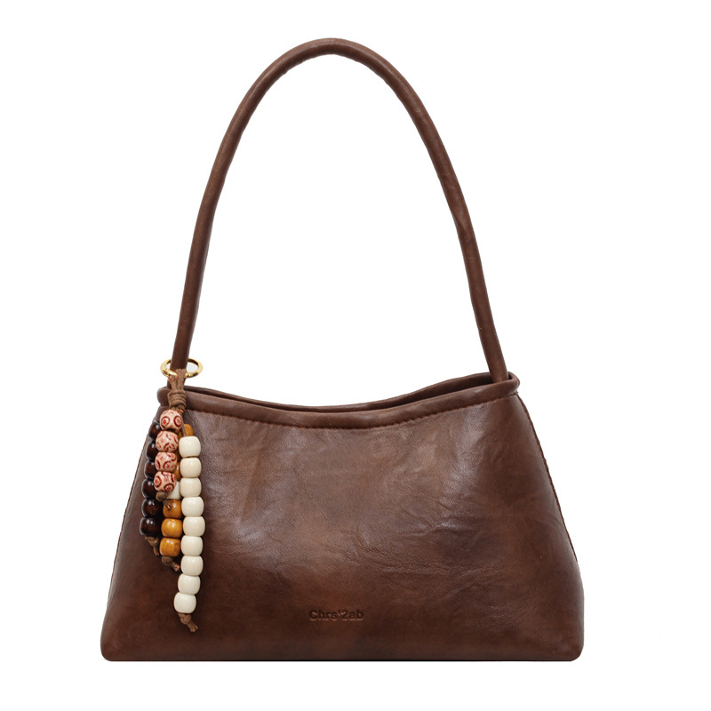 Bolsas transfronterizas para mujeres 2025, otoño y invierno, nuevo bolso coreano, bolso de brazo retro, bolso de hombro simple de moda para mujeres.