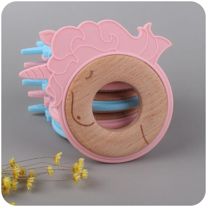 Nuevo bebé suministros de dibujos animados animal unicornio anillo de madera mordedura de bebé de goma molar de juguete de haya