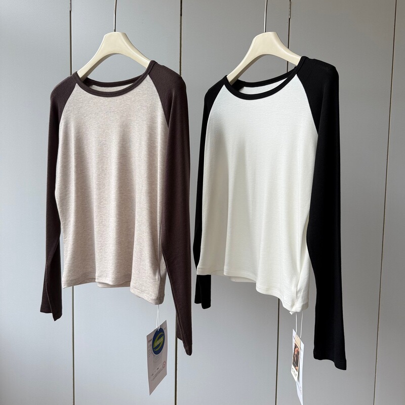 Stylish color blocking creates a beautiful and airy look! This women’s long-sleeved T-shirt features a round neck, a blend of Lyocell and wool for softness and comfort, and a stylish raglan sleeve design Stylish color blocking creates a beautiful and airy look! This women’s long-sleeved T-shirt features a round neck, a blend of Lyocell and wool for softness and comfort, and a stylish raglan sleeve design