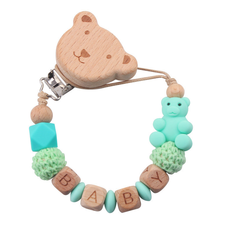 Nuevos productos para la madre y el bebé, clips de oso de haya, juguetes de dientes apretados para bebés, cadena de chupete de oso de oso de animales de dibujos animados