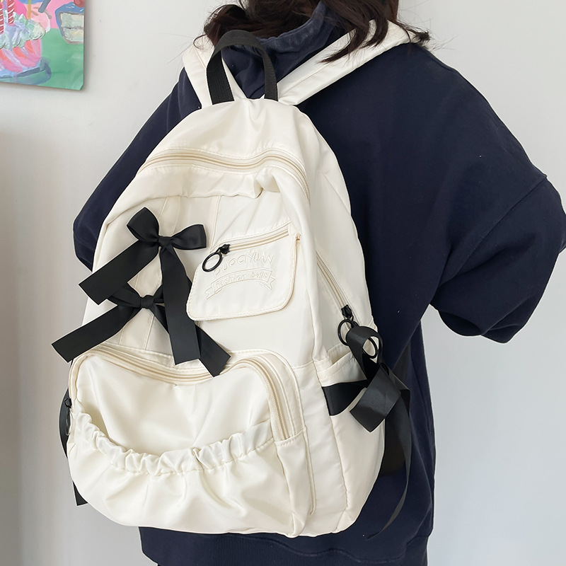 Nuevo anime japonés estilo universitario adorable arco de contraste de color plegado suave mochila de estudiantes mujeres