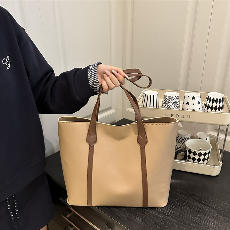 Bolso coreano de gran capacidad de alta calidad para mujeres 2025 nueva moda retro bolso de viaje tote simple bolso de hombro de color sólido