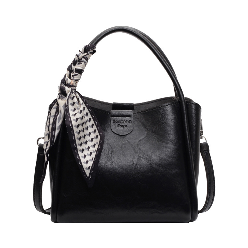 Cestas de verduras portátiles de moda simple 2024 nueva bolsa de mujer estilo extranjero versátil bolso de cubo de alta calidad nicho mochila