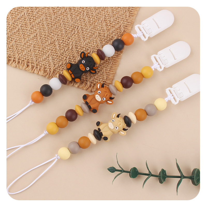 Productos infantiles de dibujos animados tridimensionales de vaca anti-caída cadena creativa bebé DIY silicona mordedor de goma molar calmar la cadena de tetina