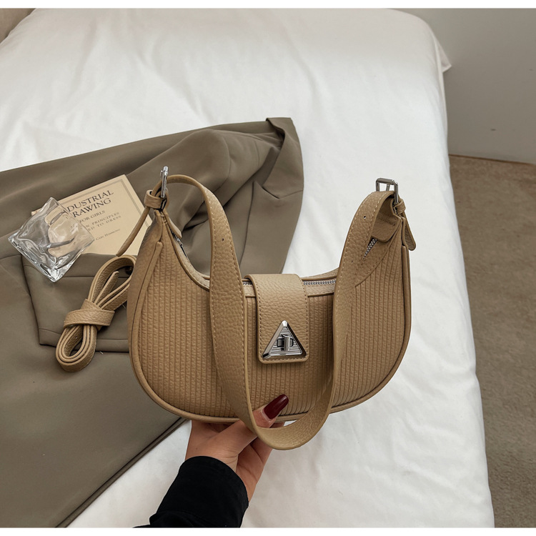 The 2025 new underarm bag for women is a simple and versatile single-shoulder crossbody bag. It is a popular and niche designer crescent-shaped women's bag undefined