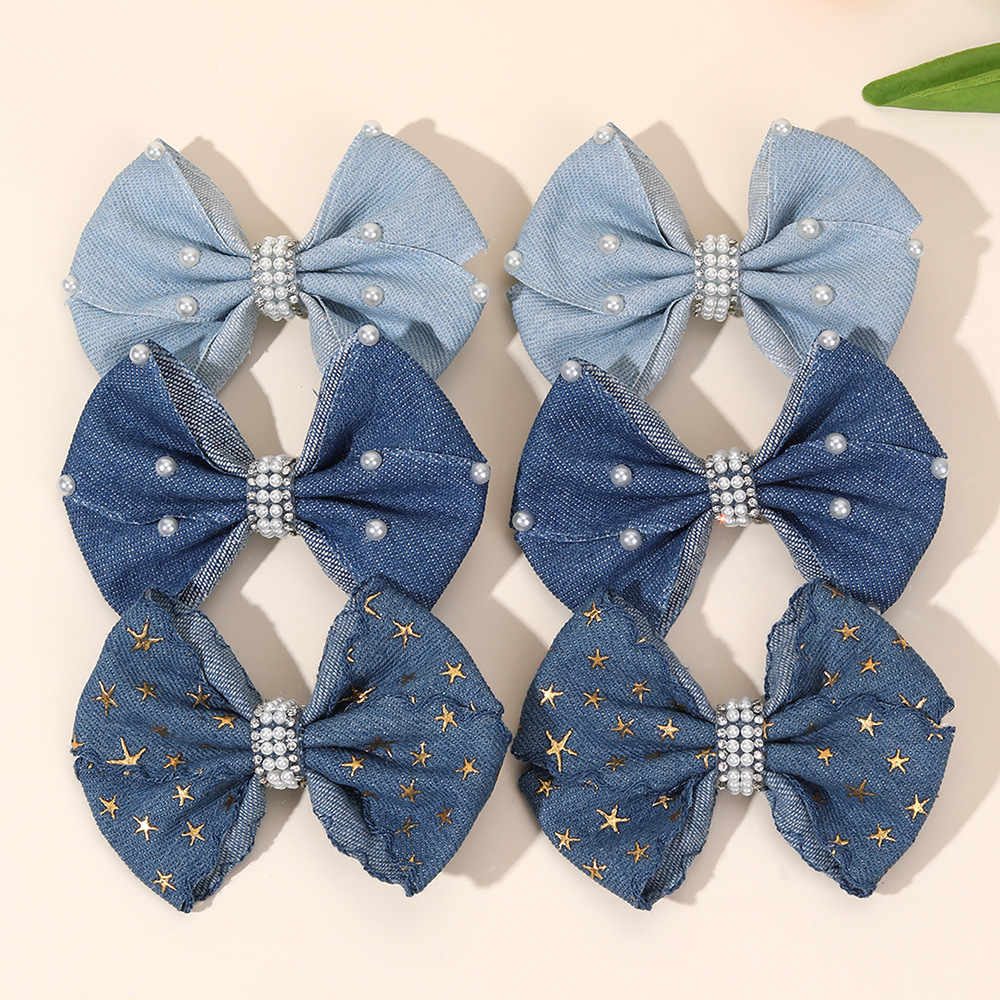 Denim three dimensional hairgrip with bow pearl