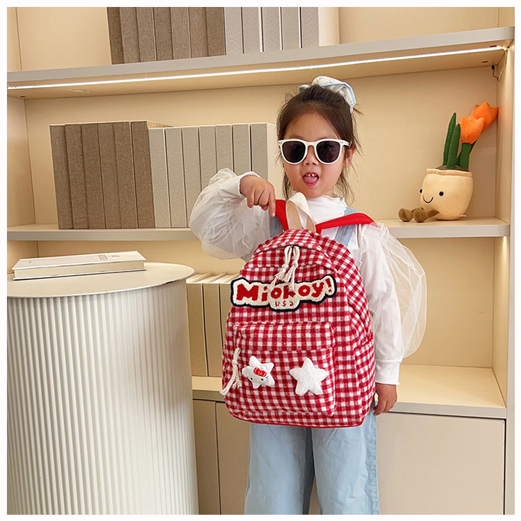 The large-capacity red woolen checkered backpack for primary and secondary school students is a unique and versatile choice. It's a trend for girls to carry backpacks during their leisure trips undefined