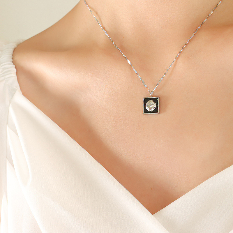 Temperamento francés incrustaciones de acrílico en relieve colgante collar personalidad pendientes moda titanio acero joyería traje