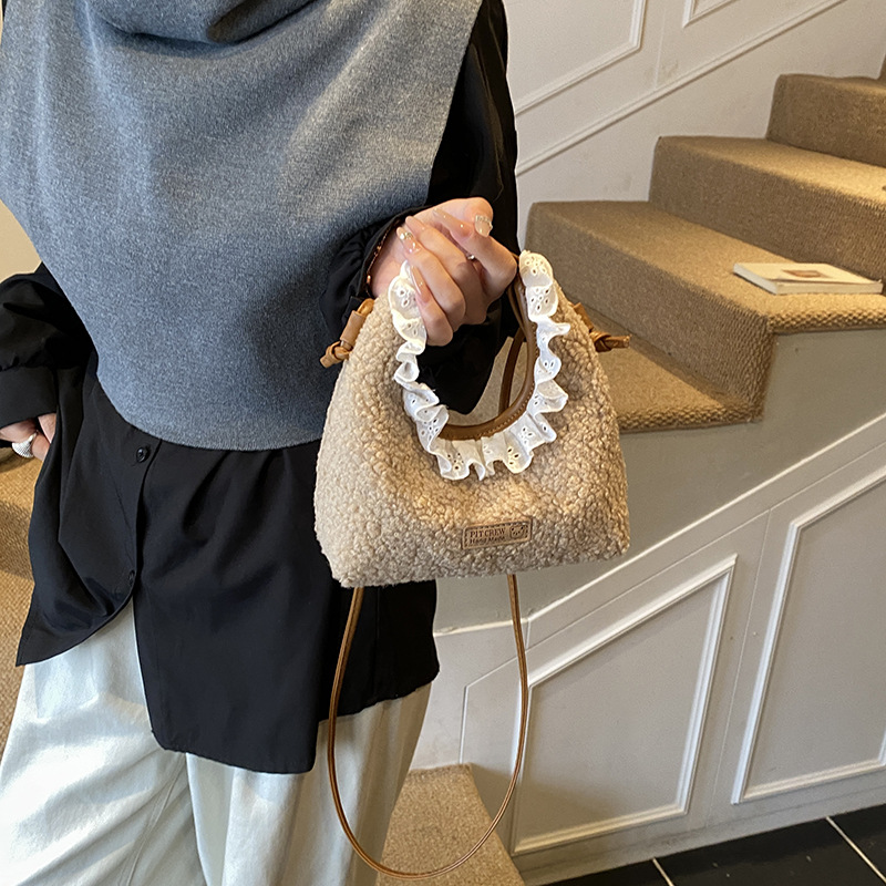 Bolsos para niños nuevos bolsos de encaje de color sólido extranjero nicho de diseño para padres e hijos cambio bolsos de mochila