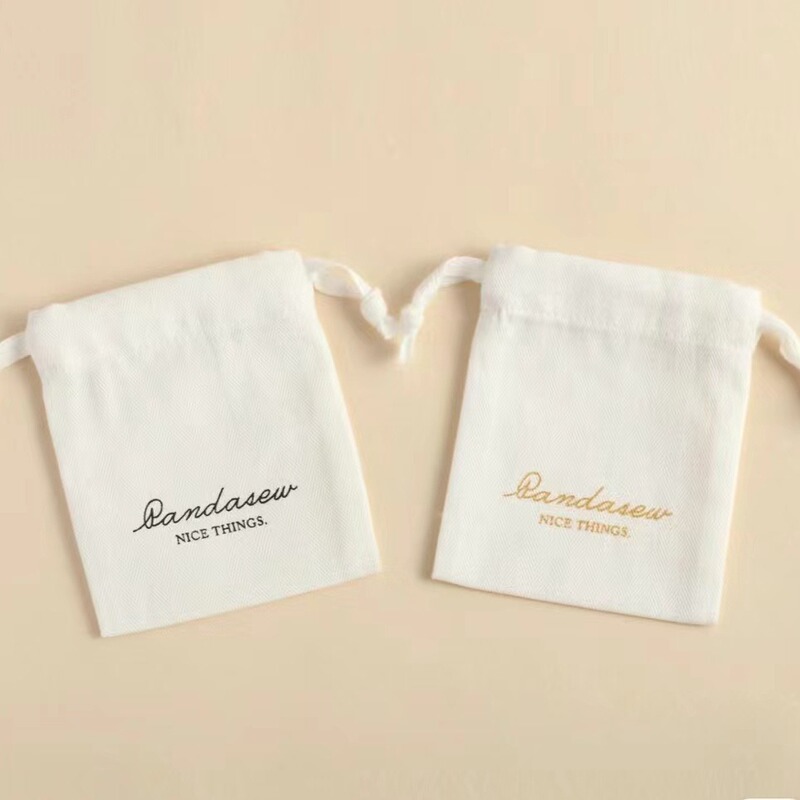 新商品の人の字の綿布のジュエリーの包装袋の交差の綾の紐の綿布袋のアクセサリーのプレゼントは袋を収納します。|undefined