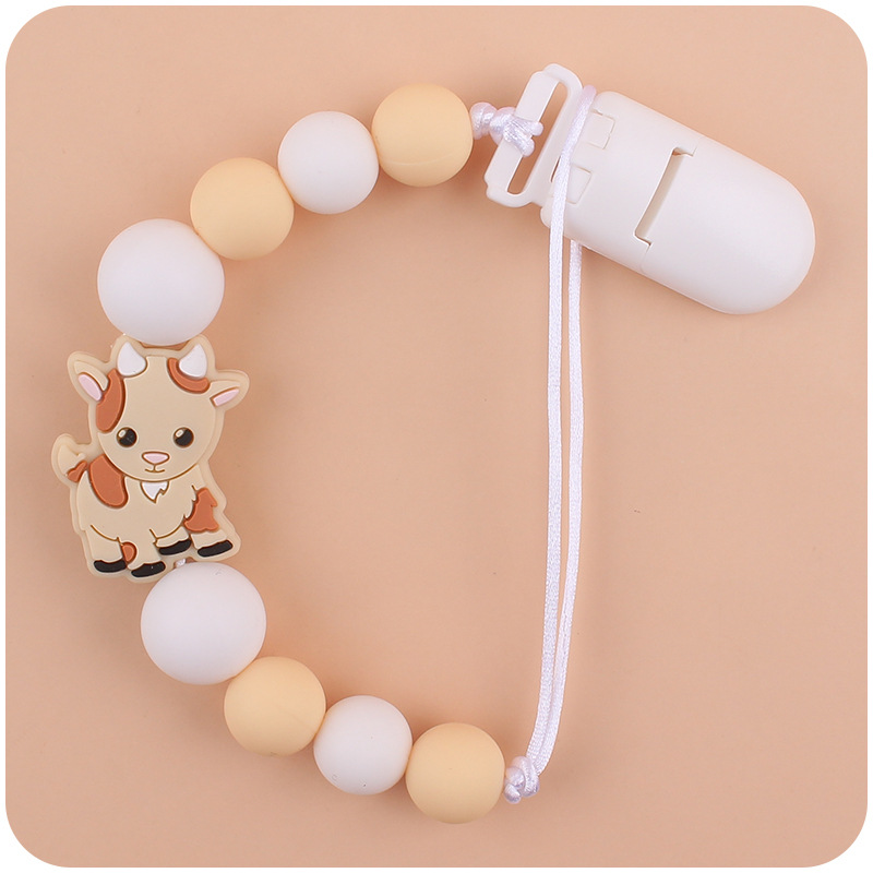 Nuevo bebé suministros chupete cadena creativa de dibujos animados Cordero silicona bebé mordedura cadena anti-gota molar