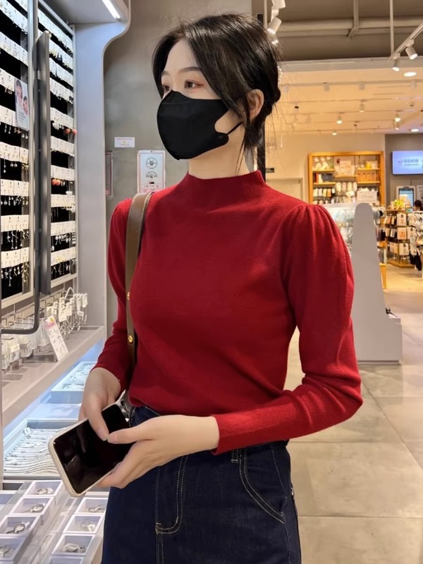 半高襟秋冬ニットセーター女性長袖ゆるいシャツの中襟に泡袖の上着がついている|undefined