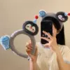 7025 little fish penguin plush headband