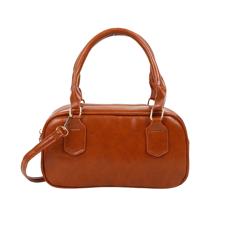 Versión coreana del bolso pequeño de Boston otoño e invierno nuevo bolso portátil para las axilas bolso de bolos literario de moda bolso diagonal de un solo hombro