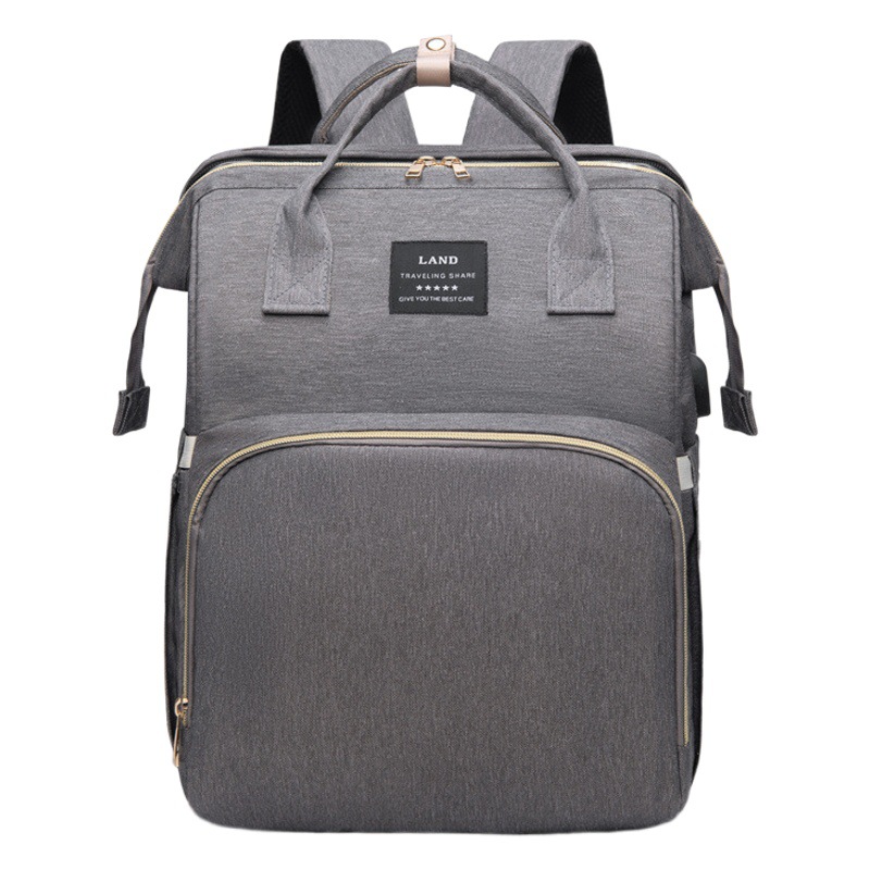 Japonés y coreano nuevo bolso de la momia mochila Oxford impermeable ultra-ligero de gran capacidad hacia fuera la madre y el bebé bolsa de leche para juguetes gratis