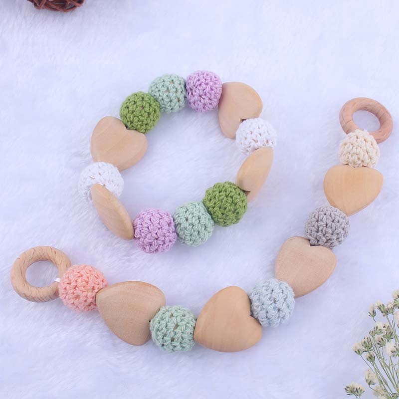 Nueva historieta del bebé haya amor mordedor juguete DIY macaron gran bola de lana mordedura pulsera