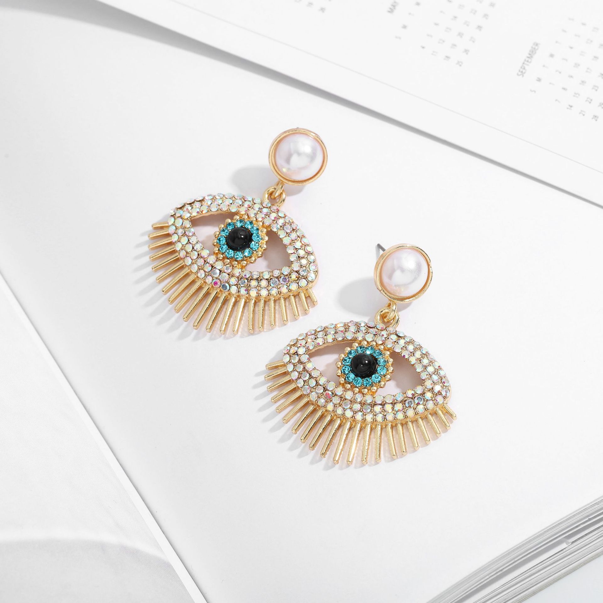 Metal Fashion Pearl Devil Eye Earrings display picture 8