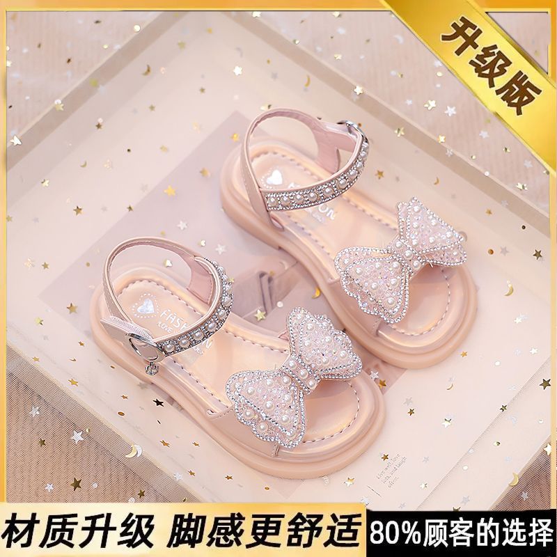 Niños verano 2026 nuevas sandalias de niñas arco brillante con base suave princesa sandalias de viento para niñas sandalias