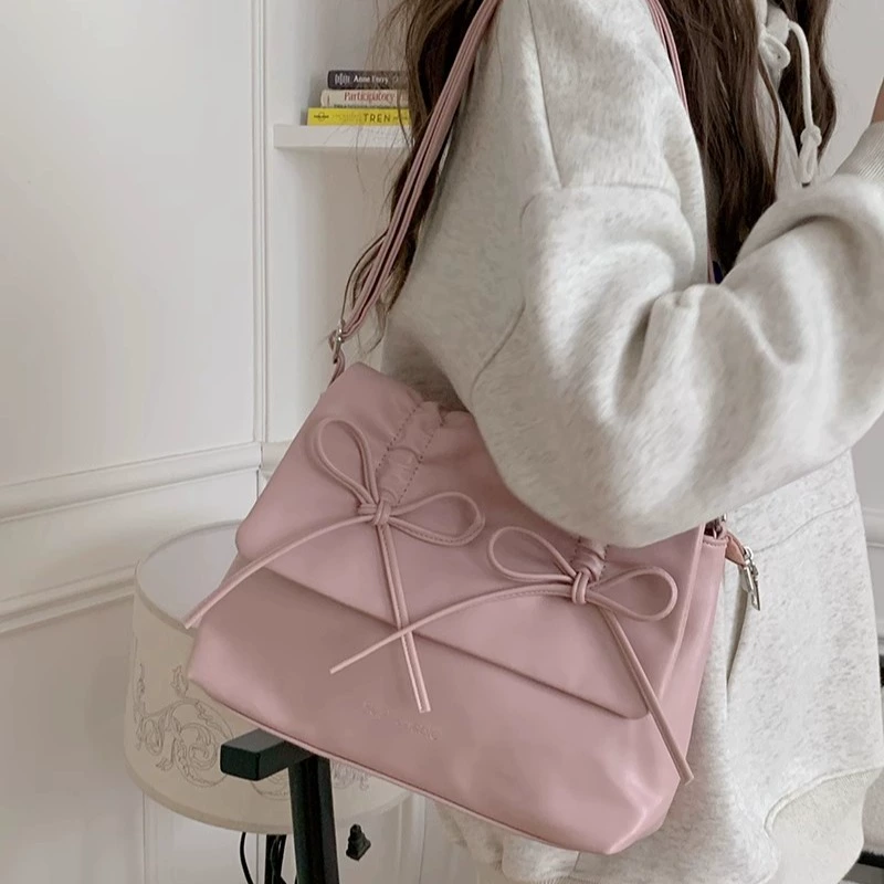 Cute fuchsia shoulder bag with bow, capacious one-shoulder bag