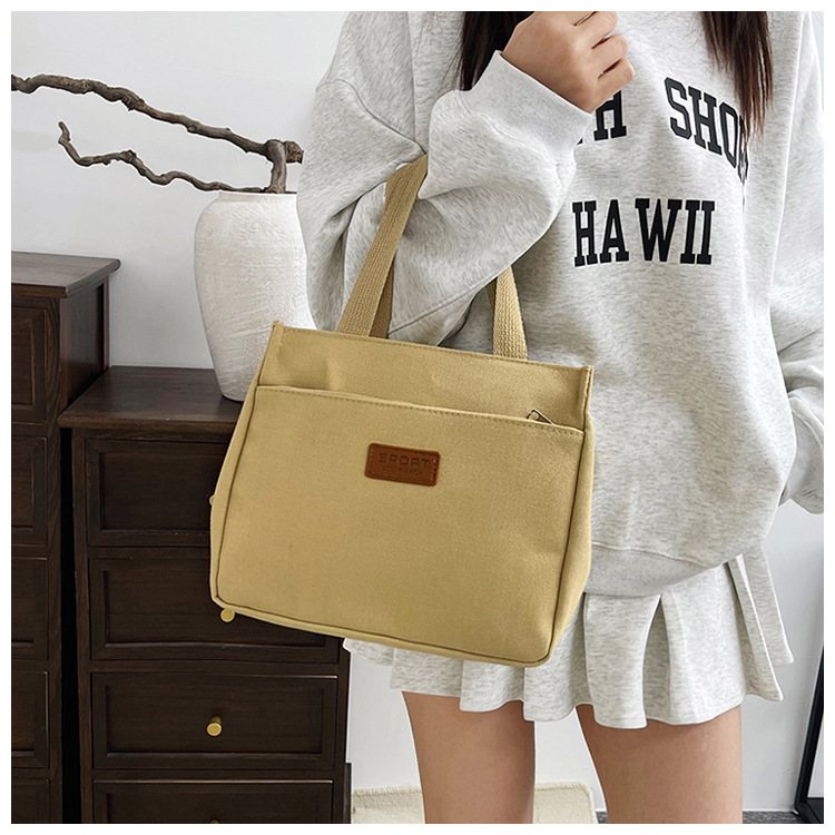 New wholesale fashionable and high-quality canvas handbag, simple and portable, easy to carry for going out, versatile lunch box and bento bag undefined