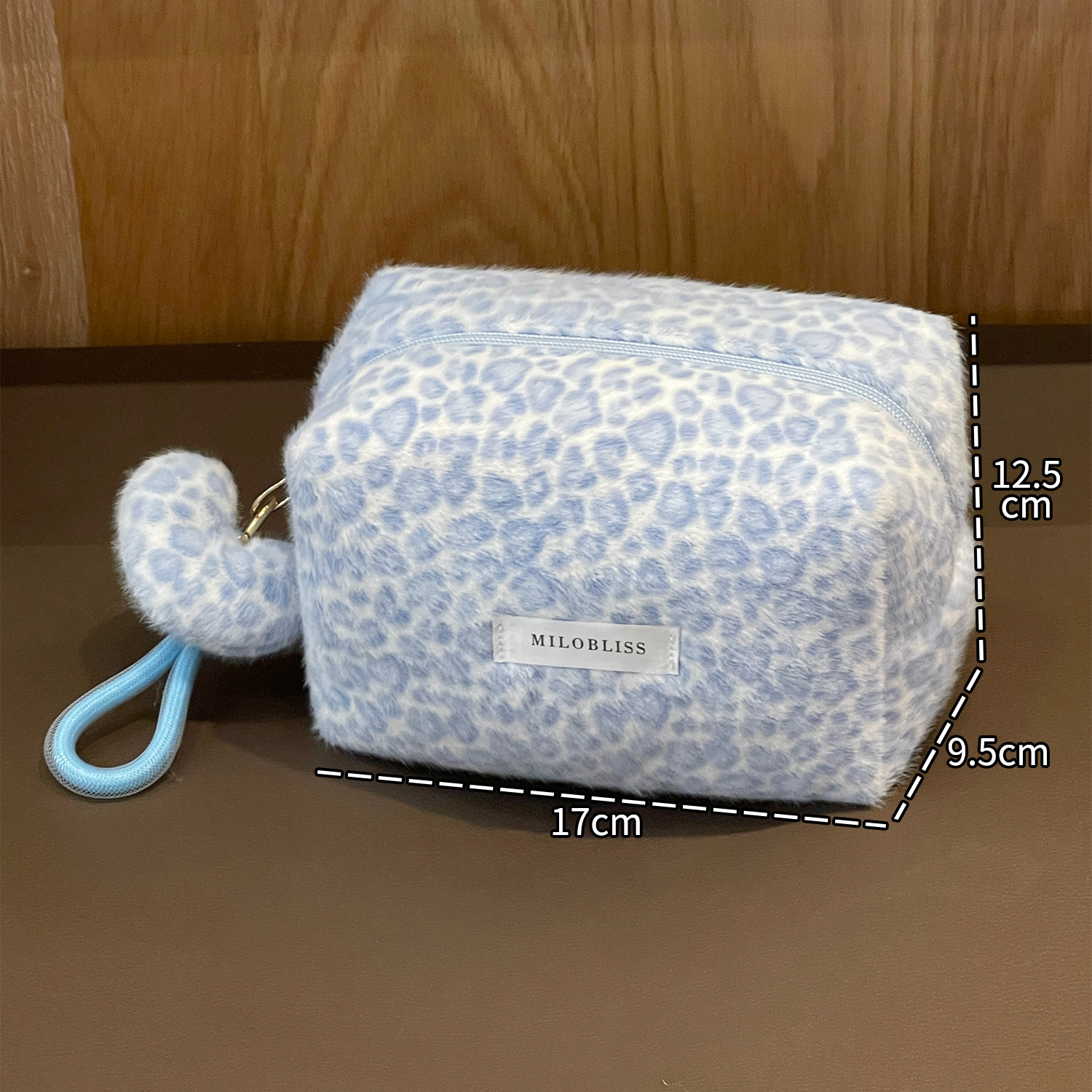 Nueva bolsa de maquillaje impresa de leopardo de peluche de pelo de conejo multifuncional portátil otoño y invierno para salir bolsa de almacenamiento de lavado de gran capacidad