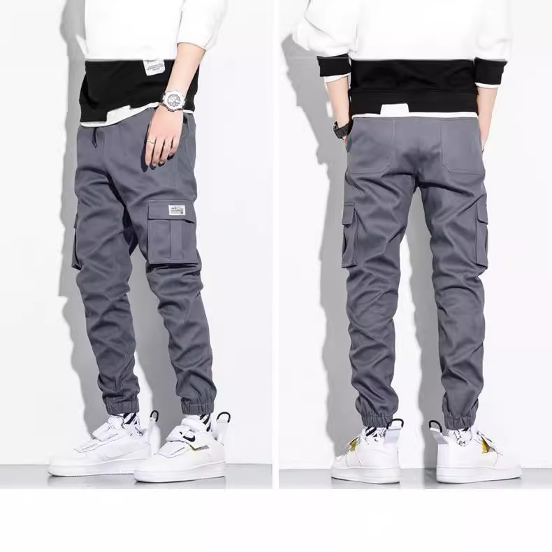 Pantalones de trabajo transfronterizos varones primavera y otoño pantalones casuales coreanos nueve pantalones de algodón delgados tendencia al por mayor comercio exterior