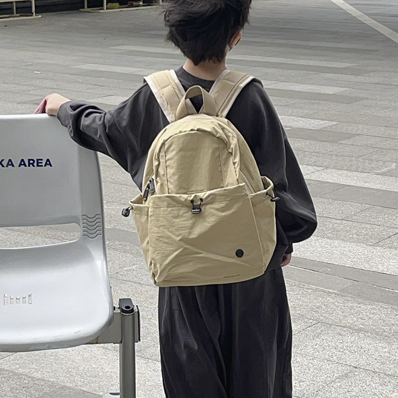 Mochila escolar de gran capacidad para estudiantes de primaria, color sólido simple, mochila casual ligera para niños y niñas 2025 nueva mochila para niños