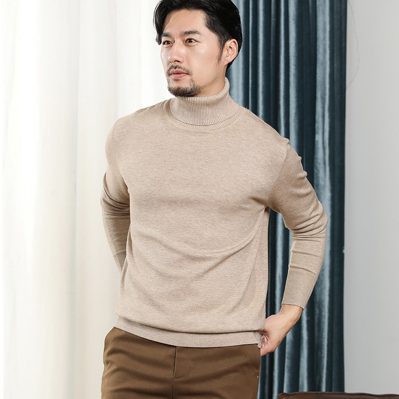 秋冬の新型男性韓国版高襟のニットの純色のビジネス男性は大きいサイズのゆったりしたセーターを打ちます。